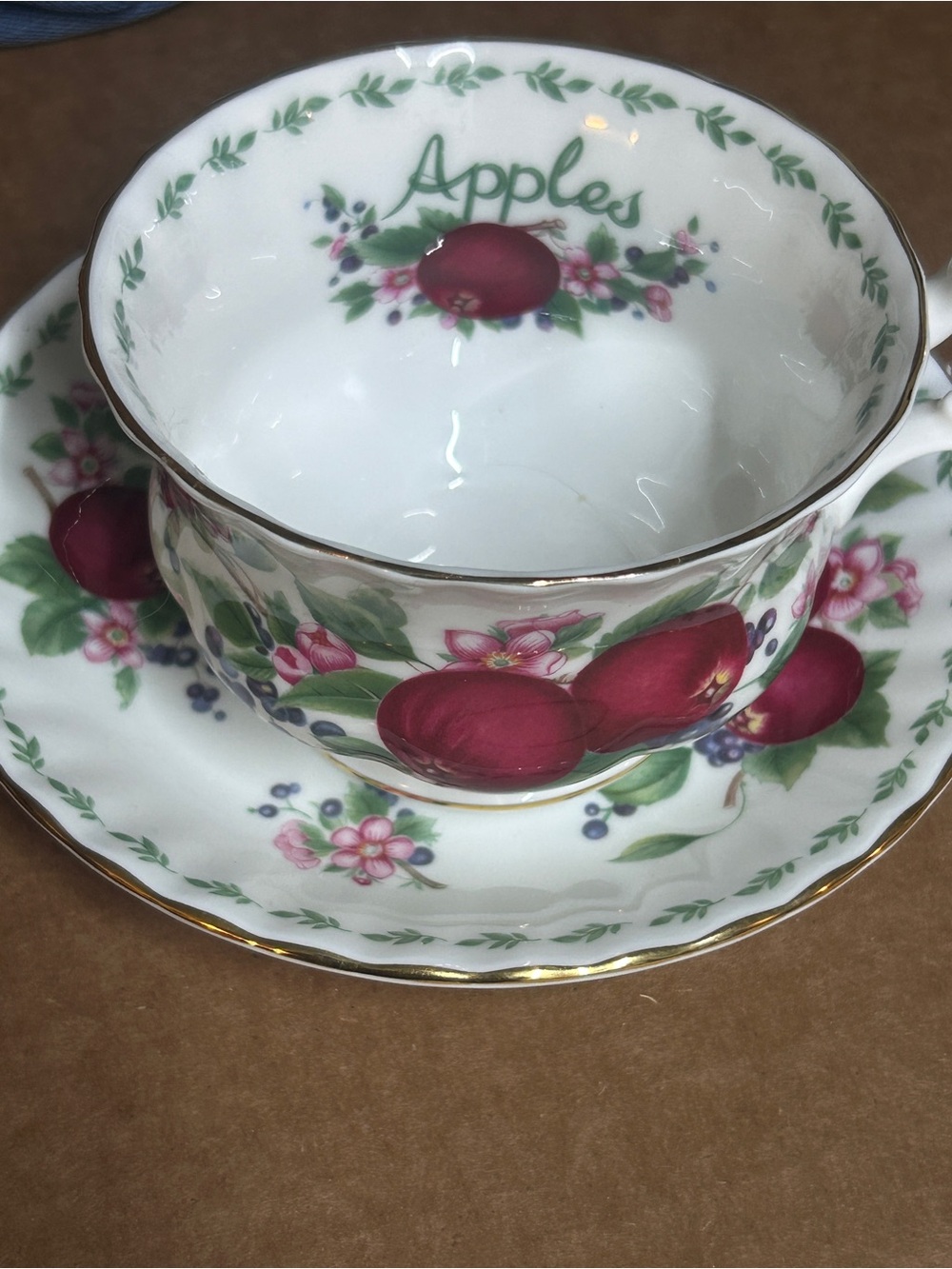 Royal Albert White Porcelain Teacup and Saucer with Red Apple Floral Motif